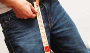 The man measuring his penis with a ruler